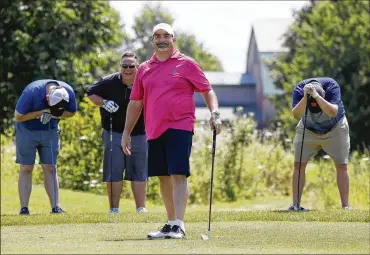  ??  ?? (From left) Joe Milacek, Dave Knowles and David Wheeler laugh after John Stamper (front) nearly hits onlookers with his tee shot during the Mediocre Golf Associatio­n’s Bratish Open held at Royal American Links in Galena on July 14.