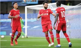  ?? Photograph: Michael Regan/PA ?? Sadio Mané celebrates with Roberto Firmino and Mo Salah after Liverpool’s second goal.