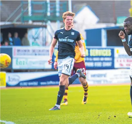  ??  ?? Above: Craig Tanner opens the scoring for Motherwell. Below: Dundee’s Sofien Moussa has a shot on goal.