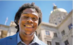  ?? AP PHOTO/MIKE STEWART ?? Davante Jennings poses for a photo at the state Capitol on March 28 in Atlanta.