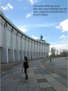  ??  ?? The writer admiring one of Moscow’s many buildings that are stoic, expansive and hark back to an era of glory.