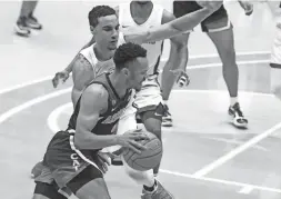  ?? DEAN HARE/AP ?? Arizona guard Jemarl Baker Jr. drives around Washington State forward Tony Miller on Jan. 2 in Pullman, Wash.