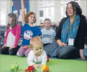 ?? Photo: FAIRFAX NZ. ?? Creating empathy: Students are encouraged to discuss aspects of a child’s developmen­t during the regular Roots of Empathy sessions and are asked questions like ‘‘why do you think the baby is crying?’’