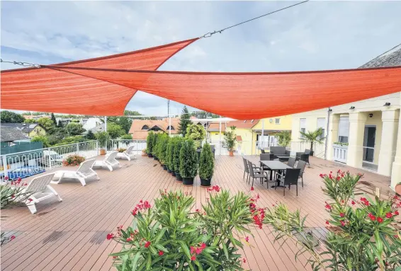  ?? CANSTOCK ?? Shade sails like these offer an easy way to add protection from the sun and rain to your backyard or deck.