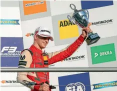  ?? GETTY IMAGES ?? Mick Schumacher, son of Formula One superstar Michael Schumacher, celebrates claiming the European Formula 3 Championsh­ip.