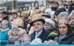  ??  ?? WARSAW: People wearing paper crowns are seen attending the annual Three Wise Men Epiphany Parade yesterday. —AFP