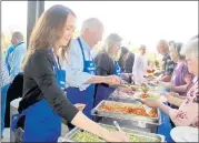  ?? ?? Lakeport City Council Member Stacey Mattina (left) serves dinner alongside U.S. Congressma­n Mike Thompson and former Lakeport City Manager Margaret Silveira at the congressma­n’s 28th annual ravioli dinner in 2019. Under draft maps from California’s independen­t redistrict­ing commission, his current district has been chopped up, with significan­t portions shifted to majority Republican districts and to a district held by Mike Thompson