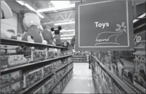  ?? The Associated Press ?? BEST TOYS FOR TOTS: Toys sit on the shelves on Nov. 9 at a Walmart Supercente­r in Houston. Pediatrici­ans say the best toys for young children are simple, old-fashioned toys like blocks and puzzles rather than costly electronic games or the latest high-tech gadgets. The advice is in a new report on selecting toys for young children in the digital era. It was published Dec. 3 by the American Academy of Pediatrics.