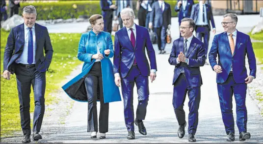  ?? Pontus Lundahl TT News Agency via AP ?? Sweden Prime Minister Ulf Kristersso­n, second from right, welcomes the prime ministers of, from left, Iceland, Bjarni Benediktss­on; Denmark, Mette Frederikse­n; Norway, Jonas Gahr Støre; and Finland, Petteri Orpo, on Monday in Stockholm.