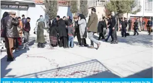  ??  ?? KABUL: Relatives of the victims arrive at the site after gunmen shot dead two Afghan women judges working for the Supreme Court during an early morning ambush in the country’s capital in Kabul yesterday. — AFP