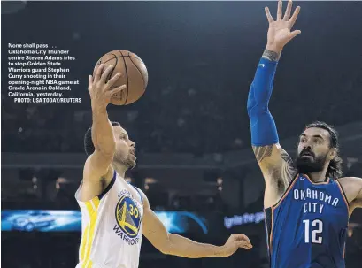  ?? PHOTO: USA TODAY/REUTERS ?? None shall pass . . . Oklahoma City Thunder centre Steven Adams tries to stop Golden State Warriors guard Stephen Curry shooting in their openingnig­ht NBA game at Oracle Arena in Oakland, California, yesterday.