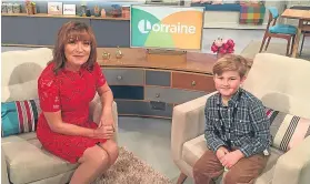  ??  ?? ■
Lorraine was honoured to meet inspiratio­nal young fundraiser Alfie.