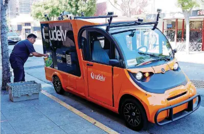  ?? [PHOTOS PROVIDED] ?? Autonomous, self-driving vehicles like the one shown could soon be delivering groceries across the Oklahoma City metro area thanks to a partnershi­p between technology company Udelv and local grocery chain Buy For Less.