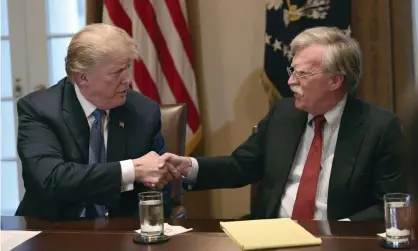  ?? Photograph: Susan
Walsh/AP ?? Donald Trump, left, with John Bolton last year. The adviser had been arguing for ‘preemptive’ attacks on North Korea.