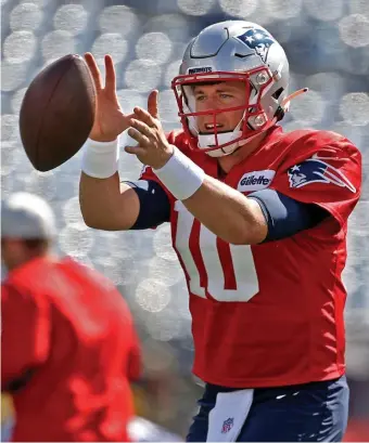  ?? MATT sTONE / HErALD sTAff ?? HUGE TEST: Mac Jones takes a snap during practice at Gillette Stadium on Friday.