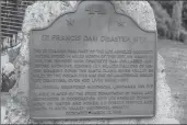  ?? Cory Rubin/The Signal ?? (Below) A brass plaque stands a mile and a half south of the former dam site, memorializ­ing the collapse as one of California’s greatest disasters.