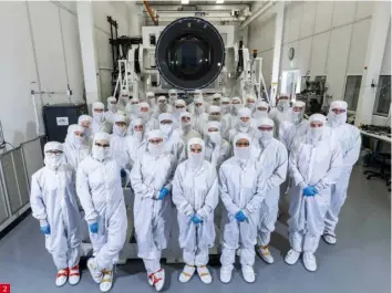  ?? ?? 2. Most of the LSST camera team, pictured in the clean room with the finished instrument. The camera they’ve helped build will look for galaxies that show signs of weak gravitatio­nal lensing, which will help astronomer­s build up a more detailed picture of the evolution of the Universe.