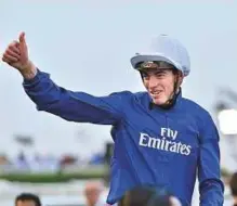  ?? Clint Egbert/ Gulf News ?? ■ James Doyle celebrates after his win in the Al Quoz Sprint ( Group 1) race on Saturday