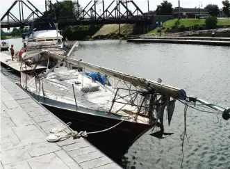  ??  ?? Although more popular with power cruisers, the Erie Canal can be traveled by sailboats, provided sailors take the rig down (above) due to the many low bridges, such as this one in Fairport, New York (top).