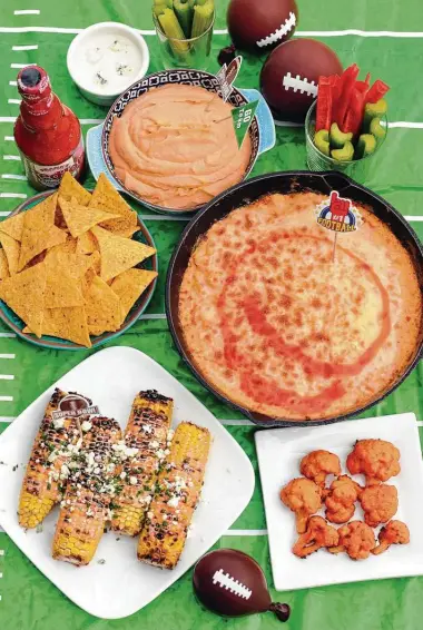  ?? Paul Stephen / Staff ?? Give your Super Bowl spread all the flavor of Buffalo wings in these hot sauce-spiked recipes.