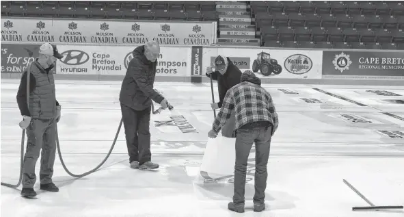  ?? GREG MCNEIL/CAPE BRETON POST ?? Dave Merklinger, centre, is the chief ice technician for Curling Canada. He was in town to prepare the ice at Centre 200 to host the Scotties Tournament of Hearts.