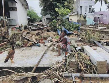  ?? Srinivaslu Konda ?? A villager in Mandapally, Andhra Pradesh state, views the aftermath of flooding that has affected southern India