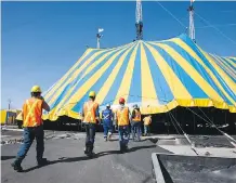  ??  ?? Circus workers and local contractor­s put up the big tent on Tuesday for the Cirque du Soleil show in Calgary.