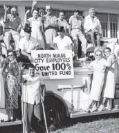  ?? Miami Herald Files ?? Back in 1959, North Miami city employees proudly displayed their donation effort to the United Way, then known as the United Fund.