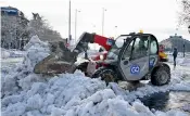  ?? AFP ?? A snowplough removes snow after a heavy snowfall in Madrid on Sunday. —