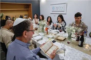  ?? (Nati Shohat/Flash90) ?? THE SEDER takes place, last year, in the Land of Israel.