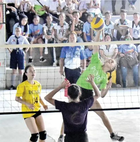  ?? MACKY LIM ?? FIERY FORM. A Davao City National High School (DCNHS) spiker shows fiery form during the secondary girls finals against F. Bangoy National High School yesterday at DCNHS covered court.