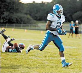  ?? SUZANNE TENNANT/POST-TRIBUNE ?? Boone Grove’s Monsoor Adisa heads to the end zone against Hanover Central on Friday. He scored two touchdowns in the game.