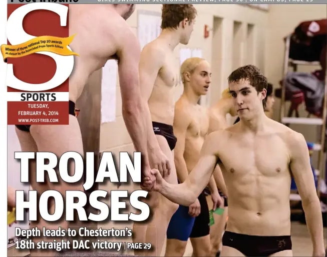  ?? | JIM KARCZEWSKI/FOR THE POST-TRIBUNE ?? Chesterton’s Ethan Whitaker is congratula­ted by teammate Patrick Curley after taking first in the 200 IM on Monday at Chesterton High School.