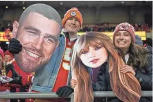  ?? SAM GREENE/USA TODAY NETWORK ?? Chiefs fans wave Taylor Swift and Travis Kelce cutouts at Arrowhead Stadium.