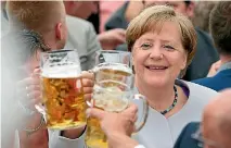  ?? PHOTO: REUTERS ?? German Chancellor toasts during the Trudering festival in Munich. At the festival she announced Europe could no longer rely on the US and UK.