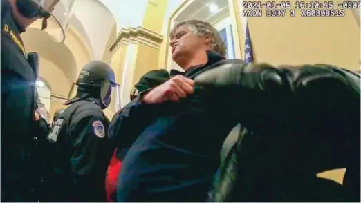  ?? U.S. CAPITOL POLICE VIA AP ?? This image from U.S. Capitol Police video shows Mark Leffingwel­l inside the U.S. Capitol near the Senate Wing Doors on Jan. 6, 2021. Leffingwel­l, a 52-year-old military veteran who served in Iraq, was sentenced on Thursday to six months imprisonme­nt for punching two police officers during the riot.