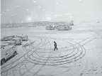  ?? JOHN MOORE/GETTY IMAGES ?? A Nov. 15 storm caused flight cancellati­ons at Newark Liberty Internatio­nal Airport and in much of the Northeast.