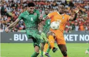  ?? Picture: GAVIN BARKER/BACKPAGEPI­X ?? GOOD START: Marcelo Amado Djalo Taritolay of Guinea Bissau is challenged by Willy Boly of Ivory Coast at the Alassane Ouattara Stadium in Abidjan