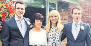  ??  ?? ●● James (right) with his brother John, mum Marie Fearns and sister Harriet