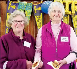  ?? ?? Bev Marshall from Drouin South and Dorothy Heywood from Torwood helped out with providing food to parking attendants.
