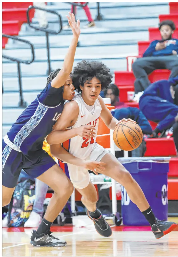  ?? Chase Stevens Las Vegas Review-journal @csstevensp­hoto ?? Valley’s Kevan Wilkins tries to drive around Legacy’s Ja’merion Brass during first-half action. Wilkins led all scorers with 27 points.