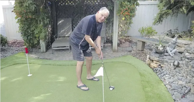  ?? LAURA SEVERS ?? “The game of golf is won on the chipping and putting,” says Rob Hodge who had a three-hole putting green installed in his backyard.