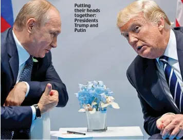  ??  ?? Putting their heads together: Presidents Trump and Putin