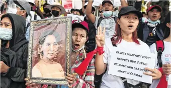  ?? PHOTO: REUTERS ?? Resistance: People rally against the military coup and demand the release of elected leader Aung San Suu Kyi, in Yangon, Myanmar.