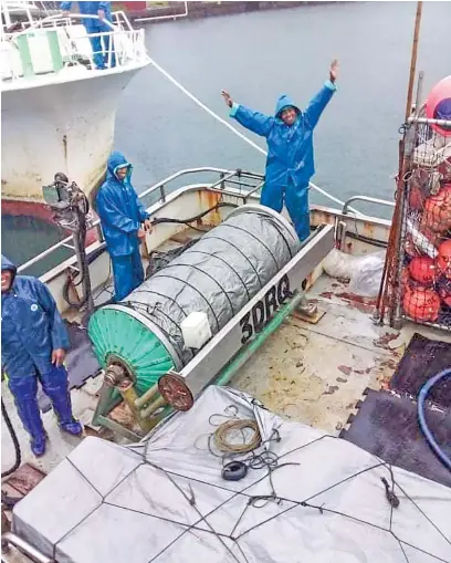  ?? Photo: NAME PHOGRAPHER ?? Three crew members of Tiro II before it departed for its voyage on May 8, 2021.