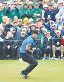  ??  ?? PATRICK REED of the United States reacts to a putt on the 18th green during the third round of the 2018 Masters Tournament at Augusta National Golf Club on April 7 in Augusta, Georgia.