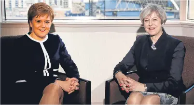  ?? Picture: Press Associatio­n. ?? First Minister Nicola Sturgeon with Prime Minister Theresa May. The constituti­onal battle being fought by the two leaders has huge implicatio­ns for business.