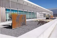  ??  ?? The front entrance of the newly opened Facebook data center in Los Lunas. The facility ultimately will have six buildings on a campus covering 2.8 million square feet.