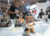  ?? WANG HAIBIN / FOR CHINA DAILY ?? An intelligen­t robot, made by Shenzhen-headquarte­red UBTECH, attracts visitors at an industry expo in Qingdao, Shandong province.