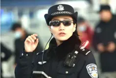  ??  ?? File photo shows a police officer wearing a pair of smartglass­es with a facial recognitio­n system at Zhengzhou East Railway Station in Zhengzhou in China’s central Henan province. — AFP photo